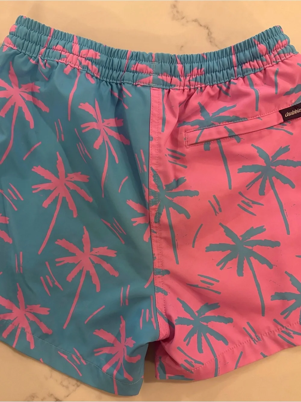 Chubbies. Boy 10-12yrs. Palm Tree Swim Shorts in Pink & Teal